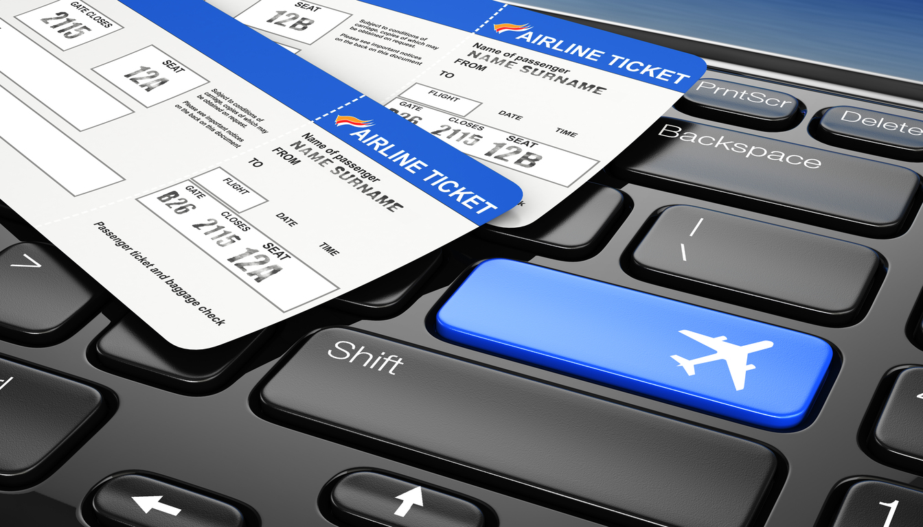 cheap flights to venice booking calendar Airline tickets on a computer keyboard with a blue airplane button, symbolizing booking flights to Venice Italy.