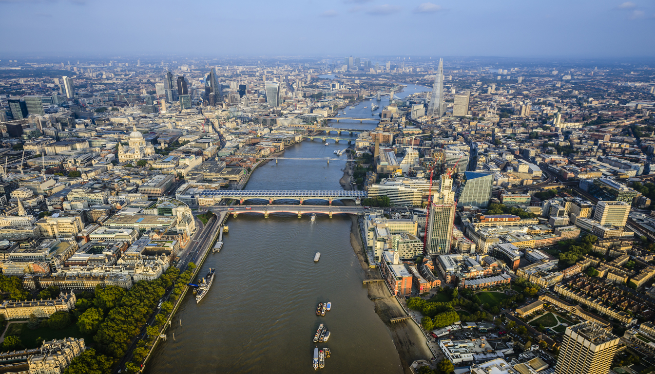 Aerial view of London skyline and River Thames near Royal National Hotel.
