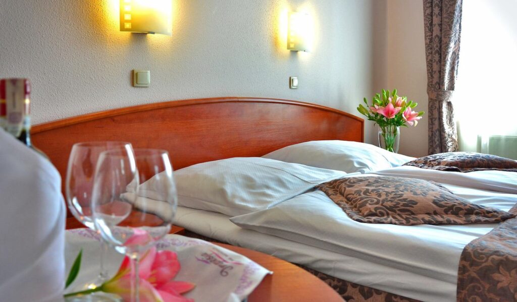 Elegant hotel room interior with fresh flowers and wine, representing the best hotels in Ireland