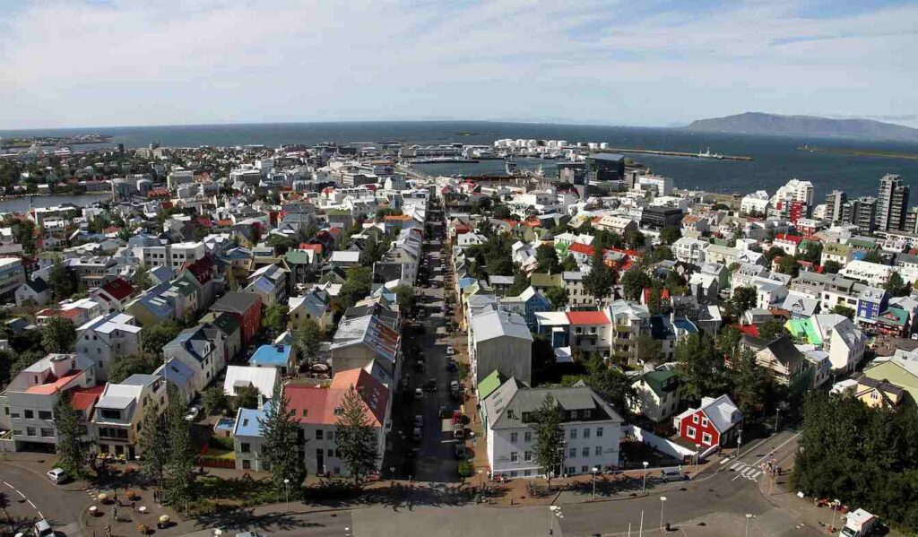 Reykjavik city view in summer, showcasing colorful houses and ocean scenery during the Best Time to Visit Iceland